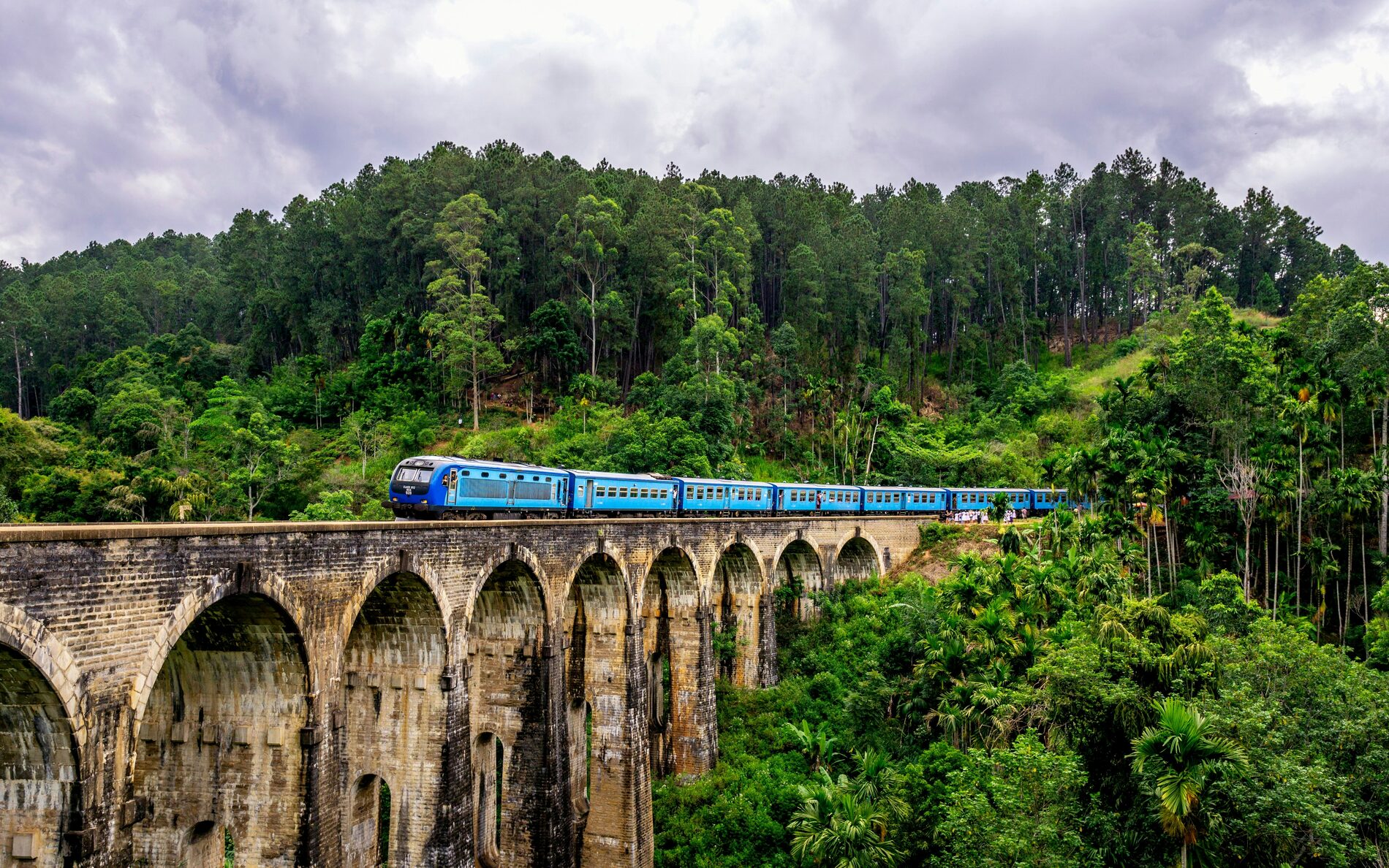 The Nine Arches Bridge near Ella, Sri Lanka, with a train crossing the jungle